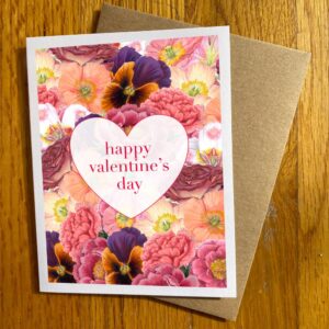 Botanical Valentine 2 Holiday Card featuring a collage of flowers in pinks overlaid with a white heart and the text "happy valentine's day"