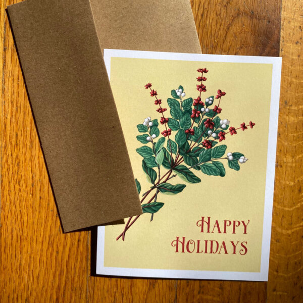 Snowberry and Honeysuckle Holiday Card featuring red and white berries on greenery on a yellow background with text reading "Happy Holidays"