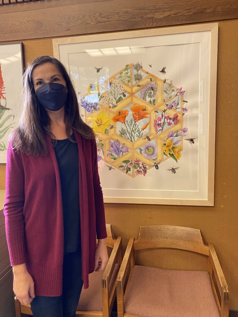 Erin with her painting Look Closer at the San Francisco Botanical Garden, during her 2022 solo show